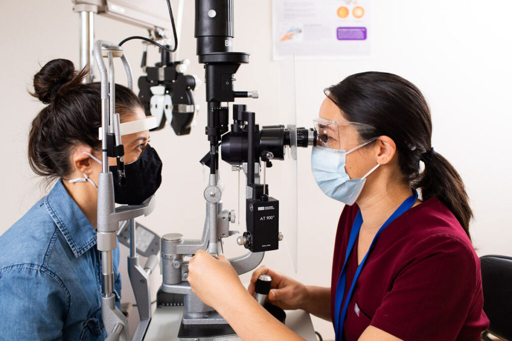 Optometrist and patient during appointment